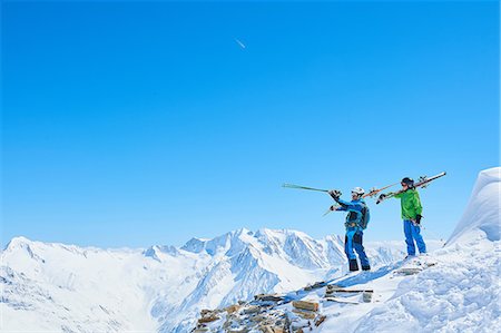 father and son skiing - Father and son on skiing holiday, Hintertux, Tirol, Austria Stock Photo - Premium Royalty-Free, Code: 614-08990112