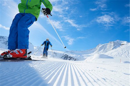 father and son skiing - Father and son on skiing holiday, Hintertux, Tirol, Austria Stock Photo - Premium Royalty-Free, Code: 614-08990125