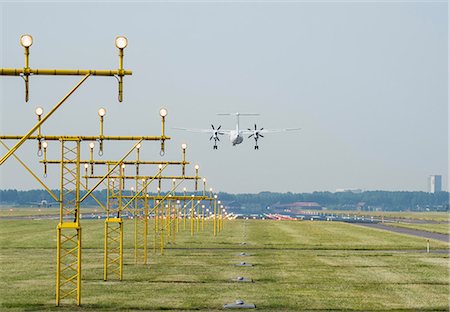 simsearch:614-08872050,k - Airplane landing by runway landing lights, Schiphol, North Holland, Netherlands, Europe Photographie de stock - Premium Libres de Droits, Code: 614-08990232