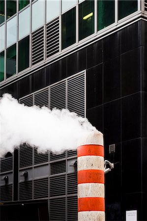 pollution urban usa - Striped smoke stack and office exterior, Times Square, New York, USA Stock Photo - Premium Royalty-Free, Code: 614-08990300