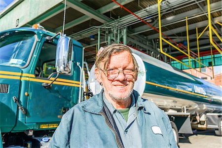 Portrait of male trucker at biofuel industrial plant Stock Photo - Premium Royalty-Free, Code: 614-08990537