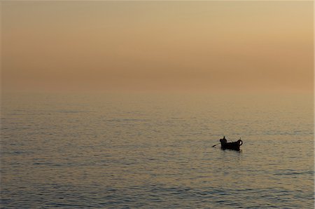 simsearch:614-06336388,k - Fisherman on water at sunset, Camogli, Liguria, Italy Stock Photo - Premium Royalty-Free, Code: 614-08990677