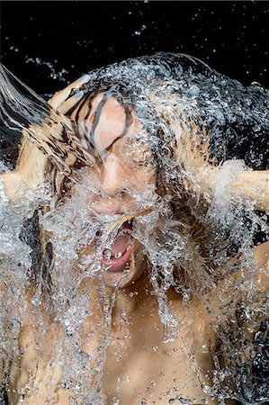 splashing water - Woman splashing water on face Stock Photo - Premium Royalty-Free, Code: 614-08990696