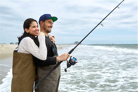 Young couple in waders sea fishing Fotografie stock - Premium Royalty-Free, Codice: 614-08990739