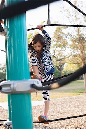 playground ropes - Girl playing in playground Stock Photo - Premium Royalty-Free, Code: 614-09017382