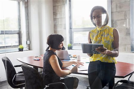 simsearch:649-08577535,k - Two women working together in meeting room, brainstorming, using digital tablet Stock Photo - Premium Royalty-Free, Code: 614-09017713