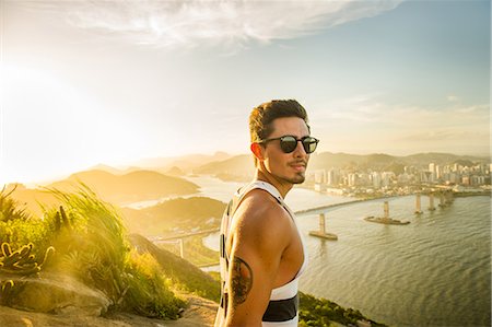 portrait tattoos for men - Man at view point during sunset, Rio de Janeiro, Brazil Foto de stock - Sin royalties Premium, Código: 614-09017774