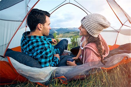 simsearch:614-09127207,k - Couple relaxing in tent, rear view Photographie de stock - Premium Libres de Droits, Code: 614-09026505