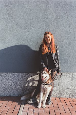 simsearch:614-08982763,k - Portrait of red haired woman with dog leaning against wall Stock Photo - Premium Royalty-Free, Code: 614-09026741