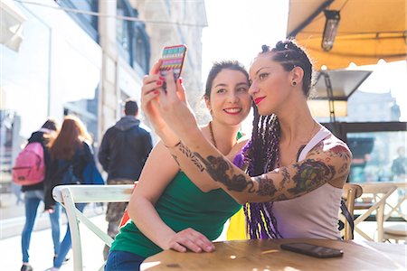 simsearch:649-09195670,k - Women on city break at outdoor cafe taking selfie, Milan, Italy Stock Photo - Premium Royalty-Free, Code: 614-09026773