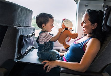 Mother and young son travelling on train, playing together Stock Photo - Premium Royalty-Free, Code: 614-09026937