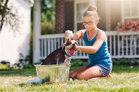 friends and buckets - Girl washing dog in bucket Stock Photo - Premium Royalty-Free, Code: 614-09026980