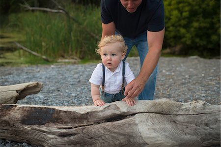 Man with toddler son toddling on beach, Lake Ontario, Canada Stock Photo - Premium Royalty-Free, Code: 614-09038708