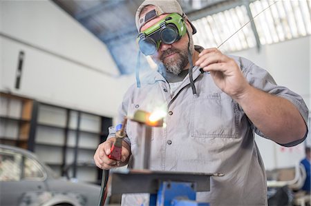 simsearch:693-07672938,k - Man welding in bodywork repair shop Stock Photo - Premium Royalty-Free, Code: 614-09038732