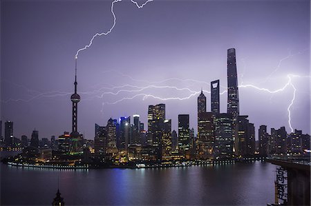 simsearch:841-06031984,k - Elevated cityscape with lightning striking oriental pearl tower at night, Shanghai, China Stock Photo - Premium Royalty-Free, Code: 614-09056574