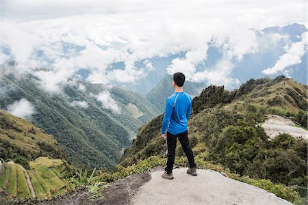 Man looking at view, enroute to Machu Picchu via the Inca Trail, Huanuco, Peru, South America Stock Photo - Premium Royalty-Free, Code: 614-09056643