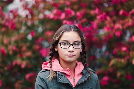 simsearch:614-09056681,k - Portrait of girl with plaits and glasses looking at camera Fotografie stock - Premium Royalty-Free, Codice: 614-09056679