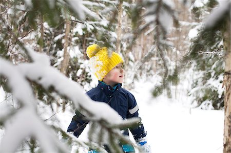 simsearch:614-09212275,k - Boy in yellow knit hat gazing in snow covered forest Photographie de stock - Premium Libres de Droits, Code: 614-09056747