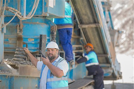 quarry - Quarry workers tending to heavy machinery Stock Photo - Premium Royalty-Free, Code: 614-09056797