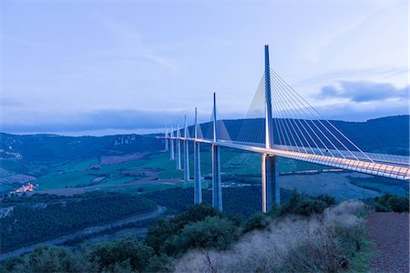 Landscape view of Millau Viaduct at dusk, Millau, Midi Pyrenees, France Stock Photo - Premium Royalty-Free, Code: 614-09056989