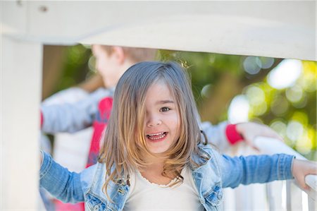 simsearch:614-09057250,k - Female toddler at preschool, portrait on climbing frame in garden Fotografie stock - Premium Royalty-Free, Codice: 614-09057261