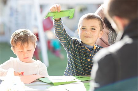 simsearch:614-05523144,k - Young boys, outdoors, doing crafting activity Stock Photo - Premium Royalty-Free, Code: 614-09057327