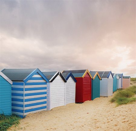 sand beach dunes - Row of colourful beach huts and storm clouds, Southwold, Suffolk, England Stock Photo - Premium Royalty-Free, Code: 614-09057425