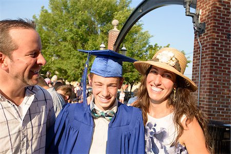 people wearing robes - Teenage boy and family at graduation ceremony Stock Photo - Premium Royalty-Free, Code: 614-09078814