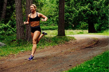 simsearch:614-06336230,k - Young female weightlifter running through forest Stock Photo - Premium Royalty-Free, Code: 614-09078832
