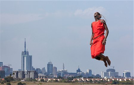 Masai warrior jumping in mid air during traditional dance, Nairobi, Kenya, Africa Photographie de stock - Premium Libres de Droits, Code: 614-09078916