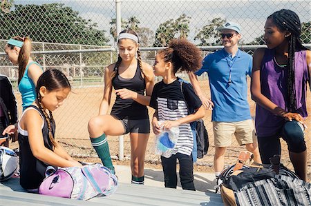 simsearch:614-08219838,k - Teacher and schoolgirls soccer players preparing for practice on school sports field Stock Photo - Premium Royalty-Free, Code: 614-09079006
