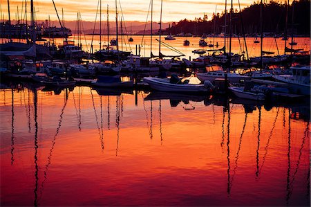 Boats in harbour at sunset, Bainbridge, Washington, USA Photographie de stock - Premium Libres de Droits, Code: 614-09127286