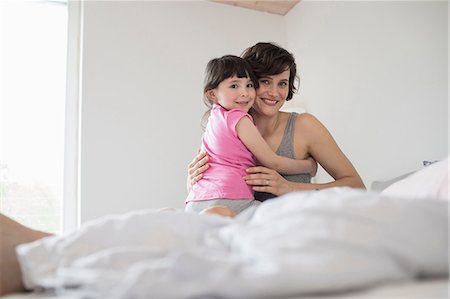 simsearch:614-09127392,k - Portrait of mother and daughter at home, hugging Stock Photo - Premium Royalty-Free, Code: 614-09127340