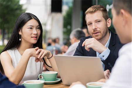 simsearch:614-09017513,k - Group of businesspeople, having meeting at cafe, using laptop, outdoors Stock Photo - Premium Royalty-Free, Code: 614-09156711
