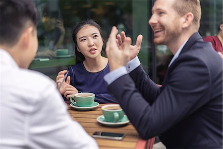 simsearch:614-09017513,k - Group of businesspeople, having meeting at cafe, outdoors Stock Photo - Premium Royalty-Free, Code: 614-09156713