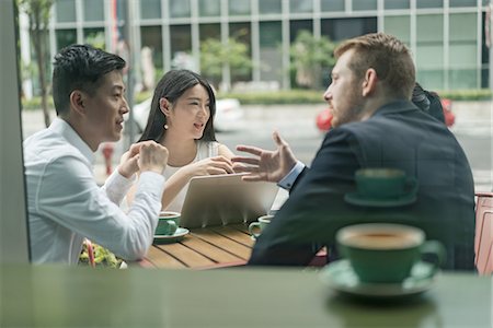 simsearch:614-09017513,k - Group of businesspeople, having meeting at cafe, using laptop, outdoors Stock Photo - Premium Royalty-Free, Code: 614-09156723