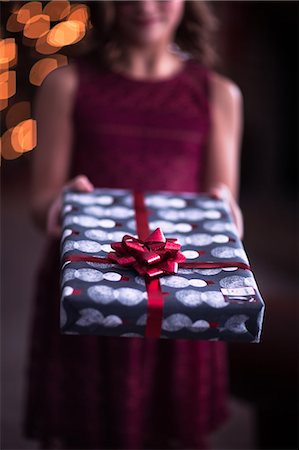 simsearch:649-08969038,k - Girl handing over Christmas gift Stock Photo - Premium Royalty-Free, Code: 614-09159649