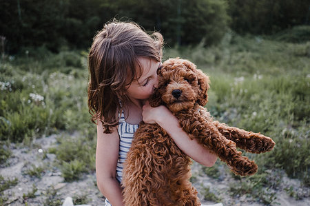 simsearch:614-08926187,k - Girl kissing puppy in her arms Stock Photo - Premium Royalty-Free, Code: 614-09178100