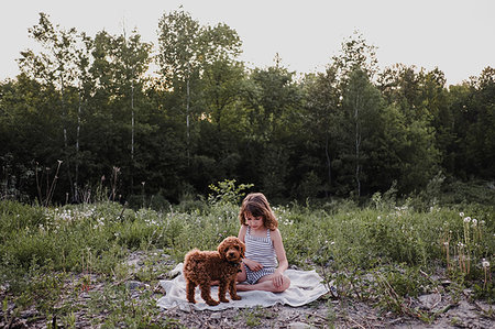 simsearch:614-08926187,k - Girl and puppy on picnic blanket Stock Photo - Premium Royalty-Free, Code: 614-09178101