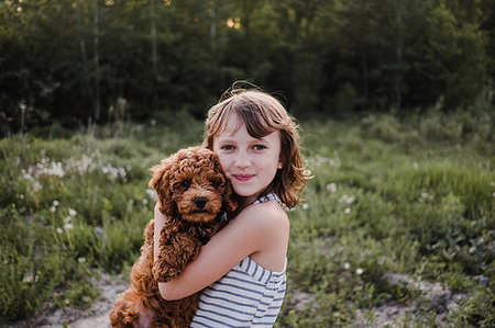 simsearch:614-08926187,k - Girl posing with puppy in her arms Stock Photo - Premium Royalty-Free, Code: 614-09178102