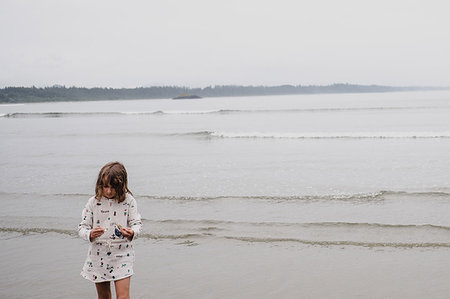 Girl on beach, Tofino, Canada Stock Photo - Premium Royalty-Free, Code: 614-09178122