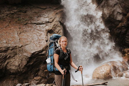 Hiker in front of waterfall, Annapurna Circuit, the Himalayas, Manang, Nepal Stock Photo - Premium Royalty-Free, Code: 614-09178180