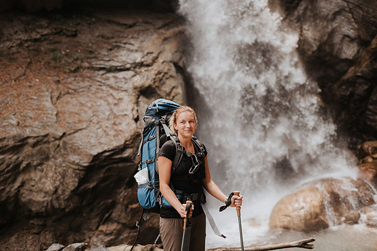 Hiker in front of waterfall, Annapurna Circuit, the Himalayas, Manang, Nepal Stock Photo - Premium Royalty-Free, Image code: 614-09178180