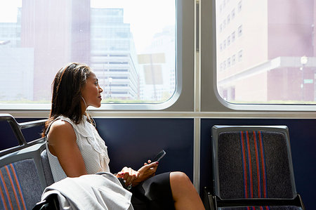 Businesswoman on train Stock Photo - Premium Royalty-Free, Code: 614-09178281