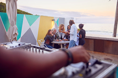 Friends at party by beach, Plettenberg Bay, Western Cape, South Africa Stock Photo - Premium Royalty-Free, Code: 614-09178394