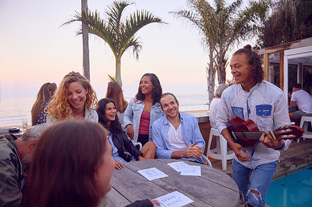 Friends at party by beach, Plettenberg Bay, Western Cape, South Africa Stock Photo - Premium Royalty-Free, Code: 614-09178398
