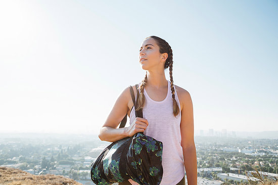 Woman carrying sports bag on hilltop, Los Angeles, US Stock Photo - Premium Royalty-Free, Image code: 614-09178424