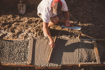 simsearch:614-09198248,k - Builder laying cement foundation Stock Photo - Premium Royalty-Free, Code: 614-09198251