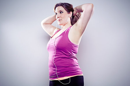 simsearch:614-07443910,k - Young woman wearing earphones, arms up Stock Photo - Premium Royalty-Free, Code: 614-09209935