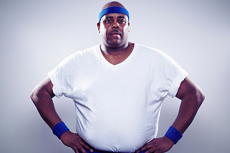 Mature man wearing white t shirt, hands on hips Photographie de stock - Premium Libres de Droits, Code: 614-09209946